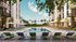 Luxury apartment complex featuring a sparkling outdoor pool, surrounded by elegant loungers, lush palm trees, and modern balconies under a clear blue sky.