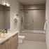 Modern bathroom featuring sleek dual sinks, elegant wood cabinetry, and a luxurious glass shower-tub combination, perfect for relaxation.