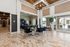 Luxurious lobby featuring elegant marble flooring, modern furniture, and a welcoming reception area with views of the outdoor pool.
