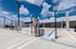 Modern parking lot featuring onsite electric vehicle charging stations.