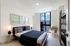 Bright, ample, and modern bedroom featuring sleek porcelain tile floors, oversized window with great views.