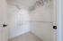 Spacious walk-in closet with  ample shelving and storage space, perfect for organizing your wardrobe.