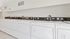 Modern laundry room with multiple washers and dryers for resident convenience.