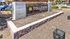 Welcoming signage at the entrance to a vibrant community in Tolleson, featuring modern design and lush surroundings.