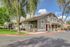 Charming apartment complex with lush greenery, showcasing modern architecture and inviting entryways, perfect for serene living.