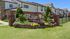 Charming two-story townhouse community with a tranquil cascading waterfall feature at The Falls at Brookhaven.