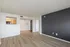Bright, open-concept living space with sleek wooden flooring and a modern design.