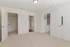 Bright and spacious bedroom featuring plush carpet, walk-in closet, and modern interior design.
