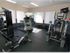 Workout room with multiple pieces of exercise equipment