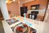 Kitchen with black appliances and decorative place settings