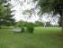 Open grassy area with park bench