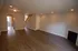 Interior of newly remodeled apartment with fireplace and vinyl plank flooring