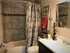 Newly remodeled bathroom with decorative tile tub surround
