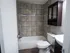 Renovated bathroom with new tile and vanity/bathroom cabinet