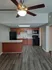 Hampton kitchen. Also showing is a ceiling fan with light in the open living room