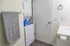 Stackable washer and dryer in bathroom