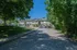 Inviting suburban residences with lush green surroundings and a peaceful street view.