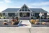 Inviting leasing center and clubhouse with charming autumn decorations and modern architecture.