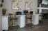 Elegant home office setup with two wooden chairs and desks, featuring stylish decor and a cozy fireplace for an inspiring workspace.