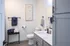 Contemporary bathroom with elegant marble countertop, modern fixtures, and stylish decor creating a luxurious ambiance.