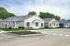Charming row of modern single-story homes with manicured lawns in a tranquil suburban setting.