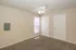 Bright and inviting room with plush carpet, ceiling fan, and ample natural light, perfect for comfort and style.