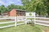 Welcome to Shady Tree Apartments, featuring charming brick architecture, lush surroundings, and a warm community vibe.