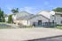 Charming residential complex with modern outdoor space, basketball court, and inviting picnic area.