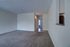 Royal Breeze Apartments Inc, interior, carpeted living room, pass-through opening, front entrance, doorways