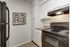 Royal Breeze Apartments Inc, interior, kitchen, white cabinets, black appliances, refrigerator, stove/oven, tile floor