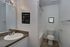 Royal Breeze Apartments Inc, interior, bathroom, tile floor, large mirror, sink, toilet, shower/tub