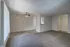 Royal Breeze Apartments Inc, interior, carpeted living room, tiled entry, closet, tiled dining room kitchen, ceiling fan, pass-through to kitchen,