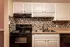 The Avenue Apartments, interior, kitchen, white cabinets, black appliances, stove/oven, dishwasher, back-splash