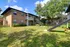 The Rio Apartments, exterior, large grassy area, two story brick buildings, stairs to second level, trees