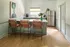 Bright and inviting kitchen with modern appliances, leather bar stools, and stylish decor.