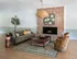 Charming waiting area with a cozy brown sofa, stylish armchair, and elegant brick fireplace; accented by a woven pendant light and vibrant decor.