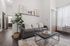 Chic modern living room with a stylish gray sofa, cozy throw pillows, and a sleek coffee table. Bright space adorned with contemporary art and lush indoor plant accent.