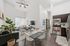 Bright and contemporary open-concept living space featuring a chic kitchen, cozy living room with modern decor, and stylish dining area perfect for gatherings.