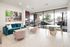 Elegant open-concept living space with stylish decor, natural light, and modern furnishings, perfect for relaxation and entertaining.