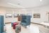 Bright and modern lounge area with panoramic windows and stylish, colorful seating.