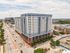Impressive modern apartment building with panoramic city views, featuring convenient access to urban amenities and stylish architecture.