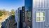 Modern apartment building exterior at 319 Bragg with sleek design and large windows, located in a vibrant neighborhood.