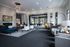 Elegant and spacious lounge area featuring modern furniture, vibrant decor, and ample natural light, ideal for relaxation and social gatherings.