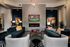 Luxurious living room with elegant furniture, modern fireplace, and stylish decor creating a cozy atmosphere.