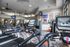 Modern gym facility with state-of-the-art treadmills, sleek design, and ample natural lighting.