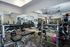 Modern gym with state-of-the-art equipment, bright lighting, and a spacious layout, perfect for fitness enthusiasts.