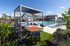 Luxurious Pool Seating with Solar Charging Tables