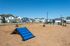 Well-maintained communal dog park with agility equipment and surrounding suburban homes.