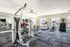 Bright and modern gym with cutting-edge equipment and ample natural light perfect for energized workouts.