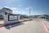 Inviting entrance to Inspire Homes showcasing modern architecture and beautifully landscaped surroundings.